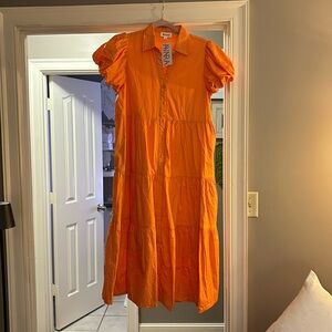 Orange Midi dress with puff sleeves.